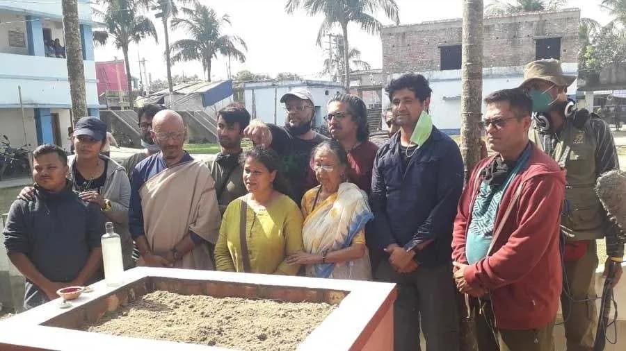 <p><em>Moitra, his family and team members plant the photographs at a high school in Gangasagar.</em></p>