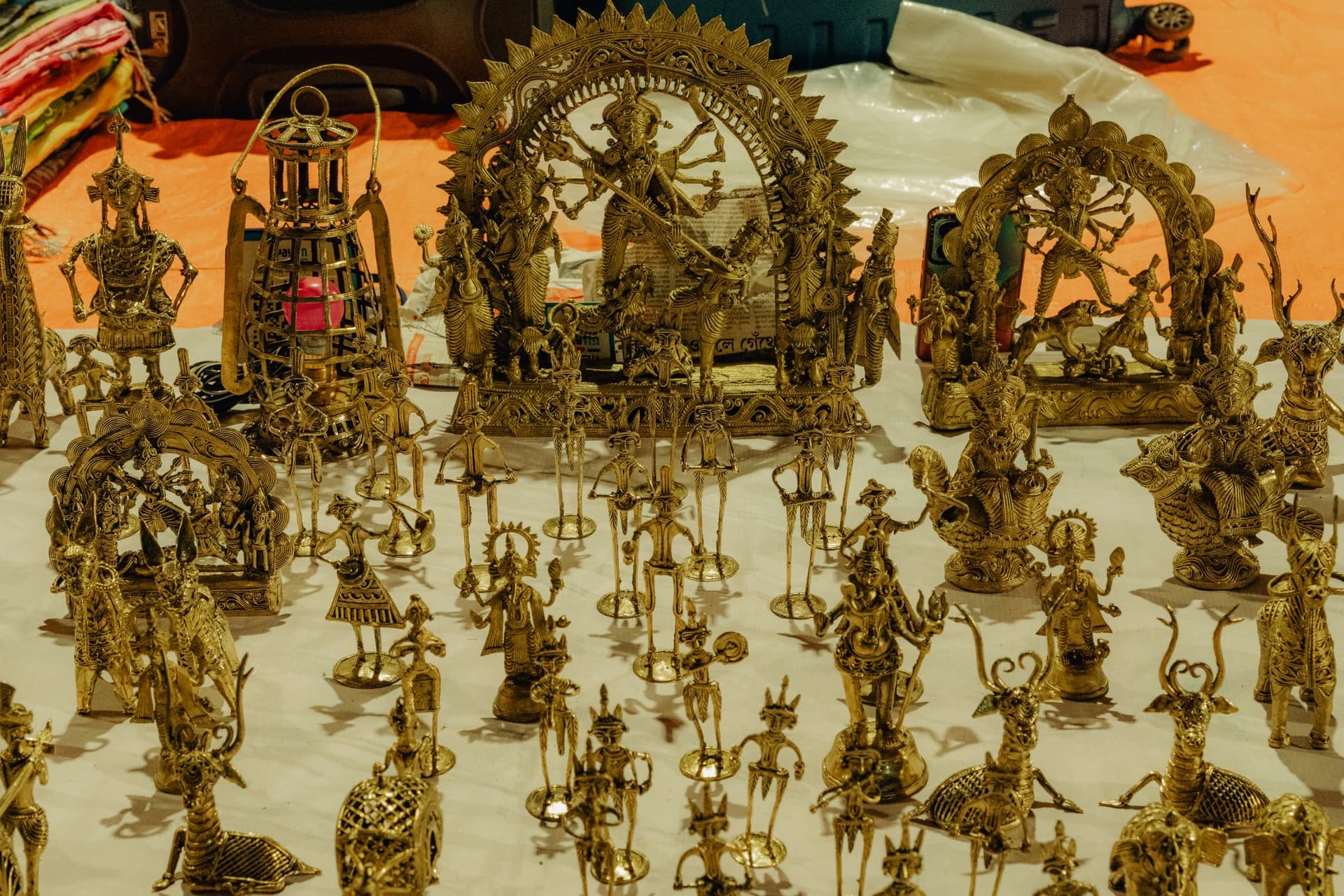 <p>Dokra figurines on display.</p>