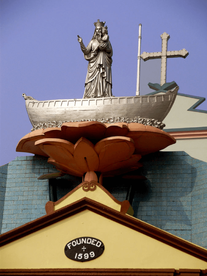 <p>The arched gateway to the church is crowned with a statue of Mary holding baby Jesus on a boat. (Picture by Rangan Datta)</p>