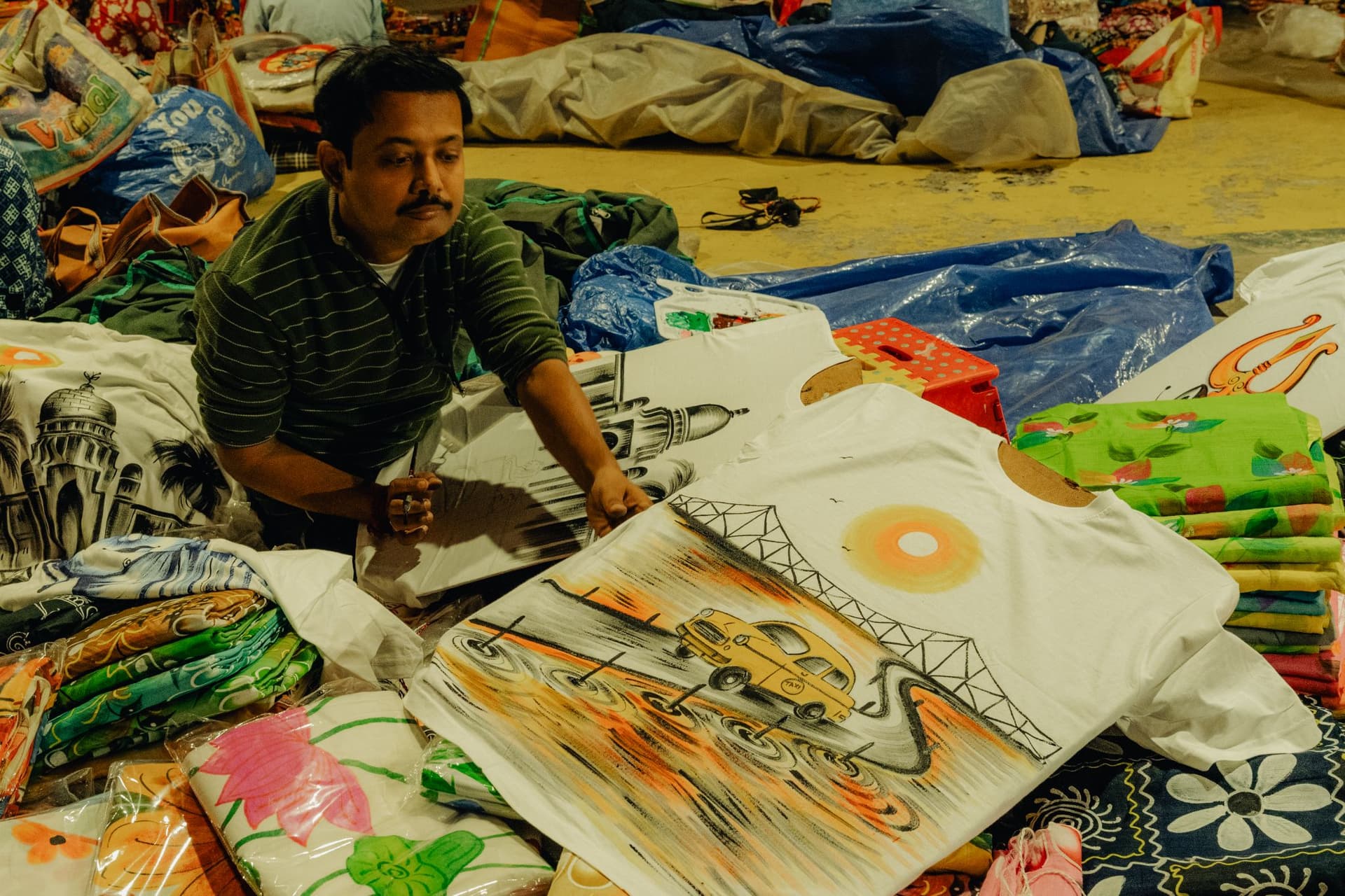 <p>Hand-painted T-shirts ready for sale.</p>