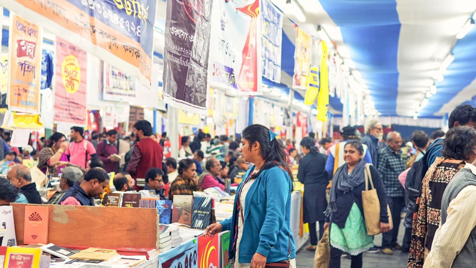 <p>Rows of colourful book stalls stretch across the fairgrounds, offering visitors everything from rare finds to contemporary bestsellers under one sky.</p>