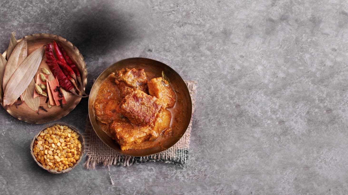 <p>Dhokar dalna (lentil cakes)</p>