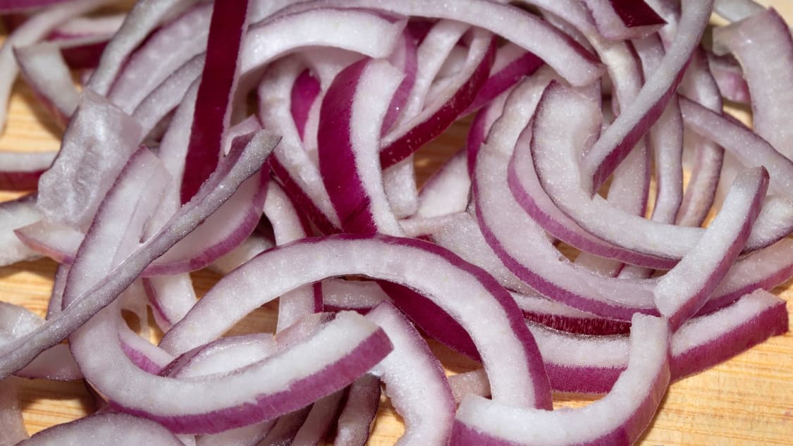 <p dir="ltr">Something as simple as finely sliced onions for slow-cooked meat dishes speaks to a quiet, practised skill.&nbsp;(Shutterstock)</p>